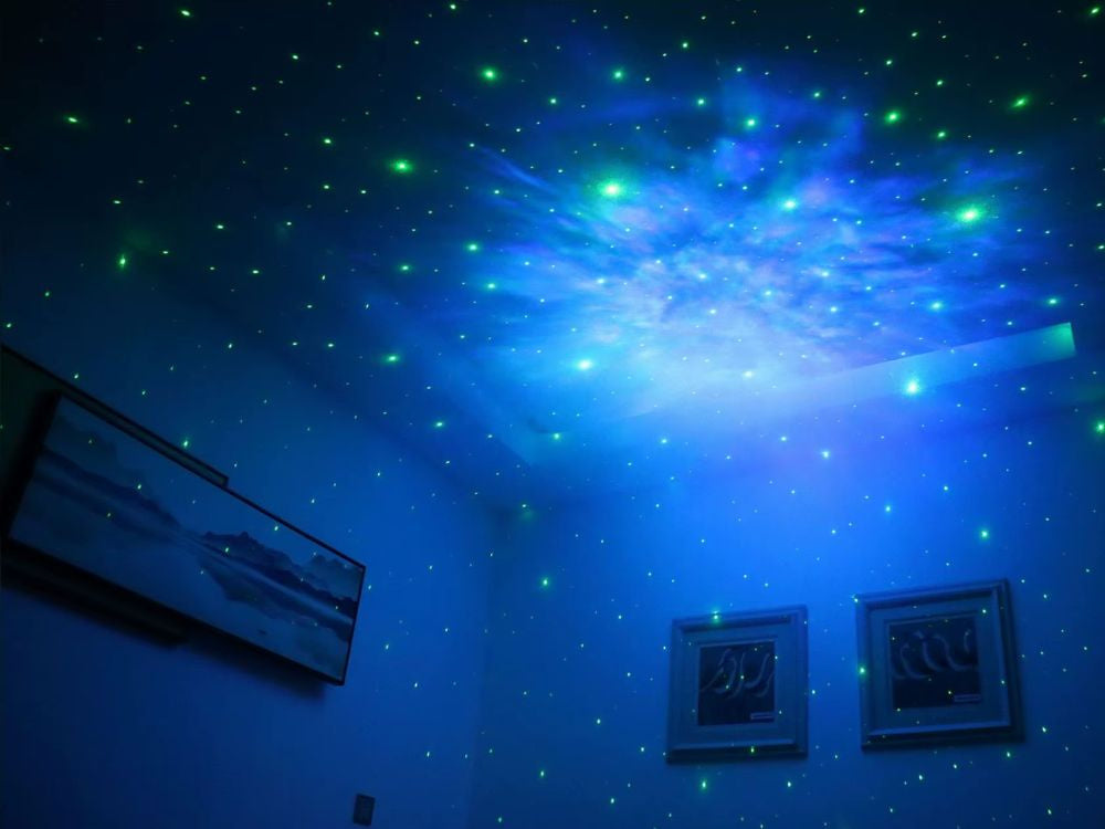 Žvaigždžių projektorius astronautas galaktikos naktinė šviesa dangaus lazeris buvo nuotolinio valdymo pultas